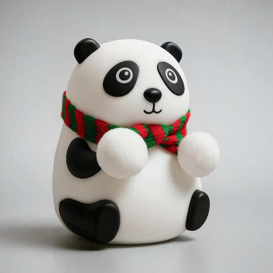 Panda figurine wearing a red and green scarf on a gray background