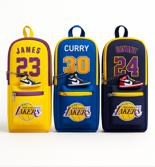 Three Lakers-themed pencil cases with player names and numbers on a white background